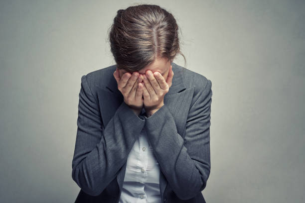 istock business woman covered face with her hand 1137788685