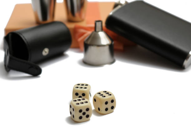 istock three cubes in front of small leather hip flask and metal mugs at orange giftbox 1137788882
