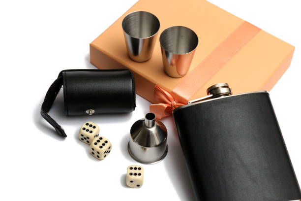 istock three cubes and a  small leather hip flask with metal mugs at orange giftbox 1137788911