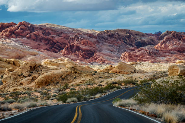 Winding highway and mountains, road trip, Valley of Fire State Park Winding highway and mountains, road trip, Valley of Fire State Park great basin stock pictures, royalty-free photos & images