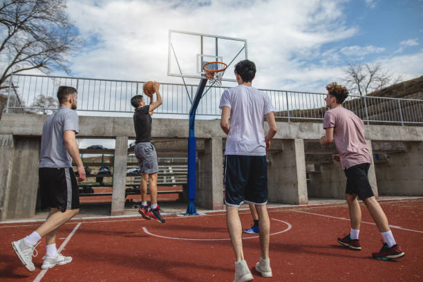 istock Dedicated people playing basketball outdoors 1137794957