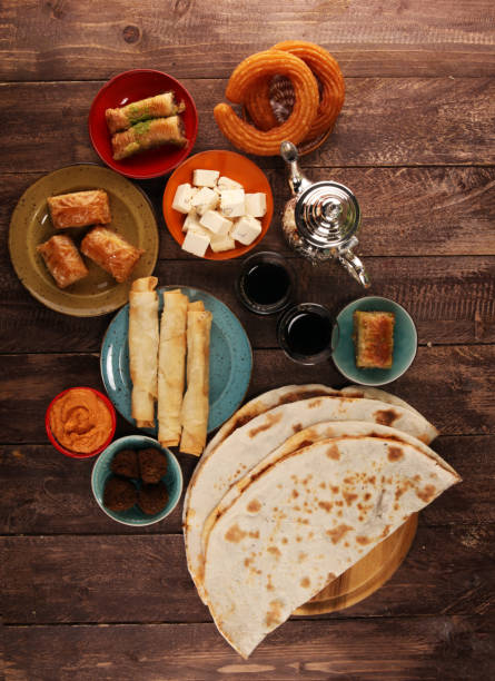 istock Middle eastern or arabic dishes and assorted meze, concrete rustic background. Turkish Bread or Turkish pizza. Dessert Baklava with pistachio. falafel with hommos.  Halal food. Lebanese cuisine 1137797747