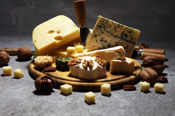 istock Cheese plate served with figs, various cheese on a platter on wood 1137798540
