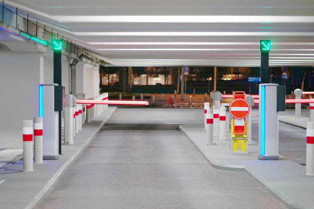 Exit from underground parking Barrier at Entrance and exit of a car Parking garage. barrier in a car park. Exit from underground parking. Underground parking/garage. Interior of parking construction barrier stock pictures, royalty-free photos & images