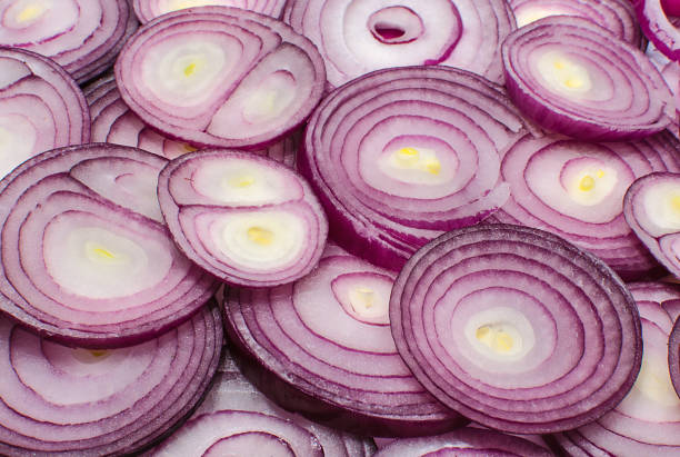 istock Red onion rings close up 1137799664