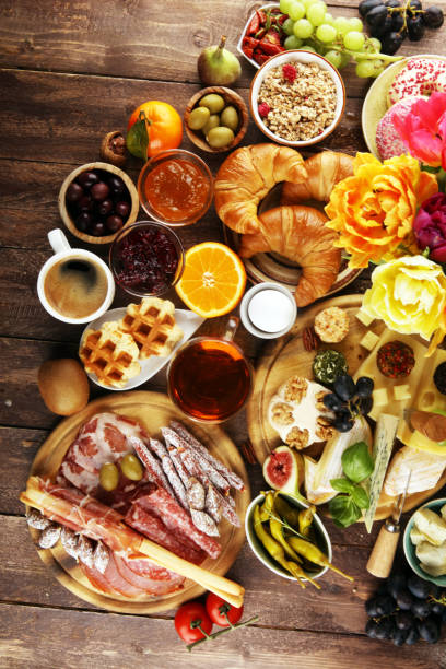 istock breakfast on table with bread buns, croissants, coffe and eggs 1137799950