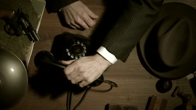 Noir film 1950s style detective making a phone call