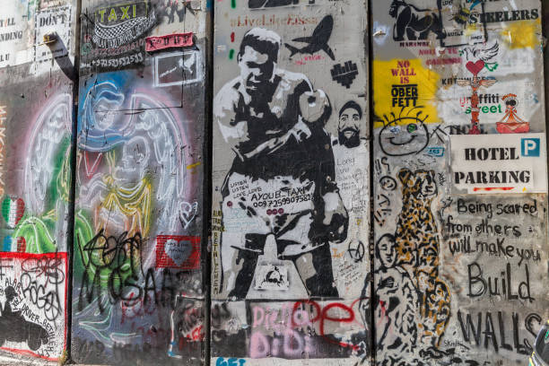 The Israeli West Bank barrier or wall Bethlehem: The Israeli West Bank barrier or wall circa May 2018 in  Bethlehem. banksy stock pictures, royalty-free photos & images