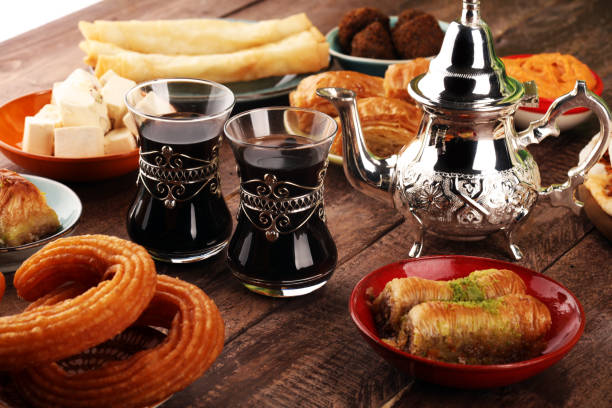 istock Middle eastern or arabic dishes and assorted meze, concrete rustic background. Turkish Bread or Turkish pizza. Dessert Baklava with pistachio. falafel with hommos.  Halal food. Lebanese cuisine 1137806811
