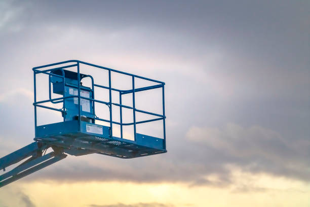 Boom lift against cloudy sky in Eagle Mountain