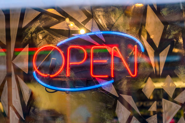 istock Neon Open sign on decorated glass surface 1137808327