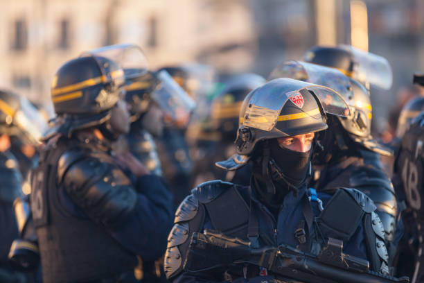 robber in black mask with shotgun isolated