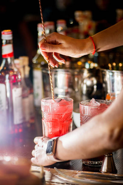 istock female bartender preparing cocktail in a cocktail bar 1137813589
