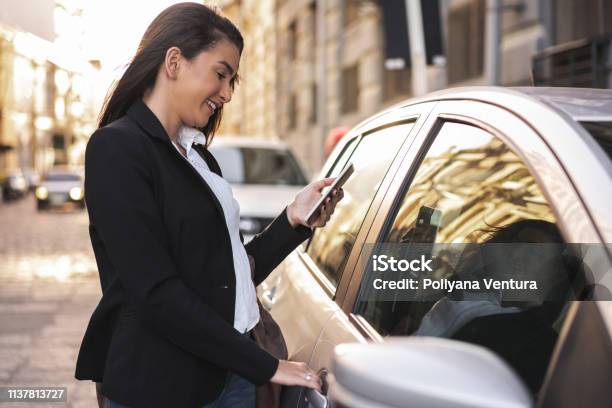 Woman Opening The Car Door Stock Photo - Download Image Now - Car, Women, Opening