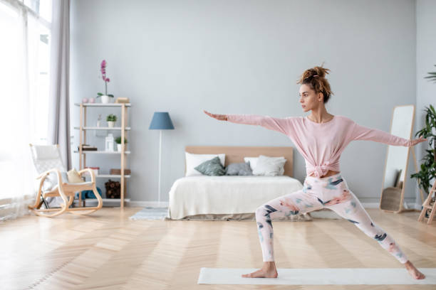 istock Young yogi woman practicing yoga pose, working out home. 1137814838