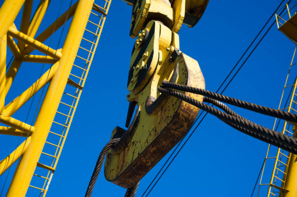 istock Loading in port. Floating port crane on blue sky background 1137815147