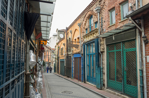 Izmir, Turkey - August 18, 2023: Cyprus martyr street ( kıbrıs şehitleri caddesi) view in a summer day, people shopping, walking on the street or eating in restaurants in izmir alsancak Türkiye.