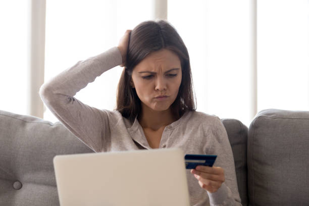 istock Puzzled young woman forgot credit card password, finance problem 1137821396