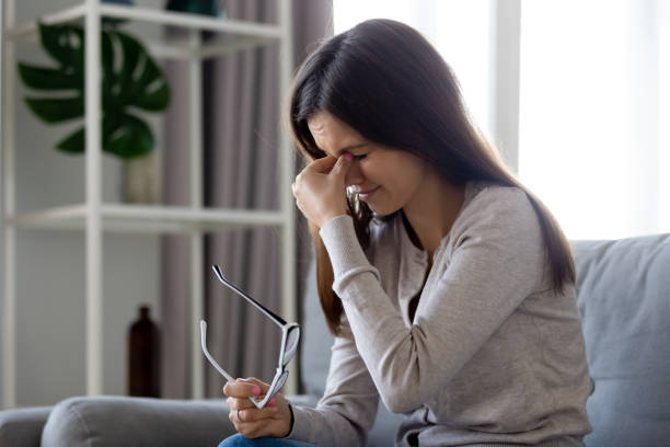 istock Upset woman taking off glasses, suffering from eye strain 1137821418