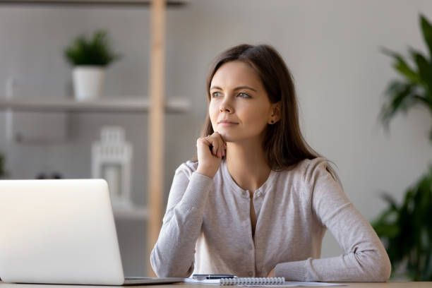 istock Thoughtful attractive woman planning, thinking about strategy in office 1137821447