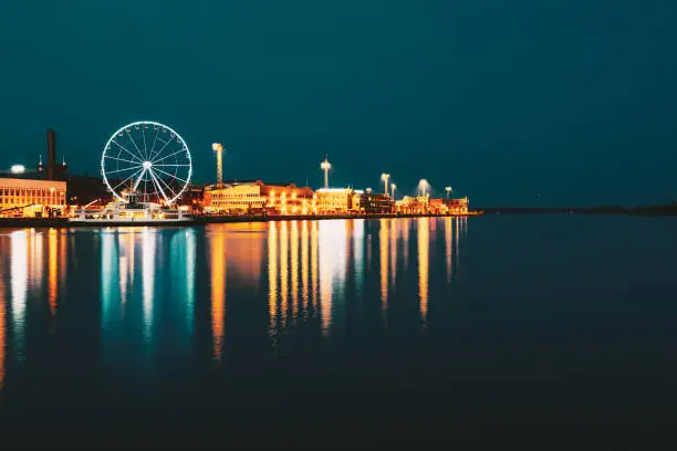 Photo of Night Scenery View Of Embankment With Ferris Wheel In Helsinki, Finland