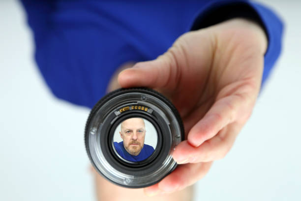 reflection of a man's face in the lens