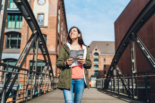 istock Woman exploring Hamburg with a map 1137831085