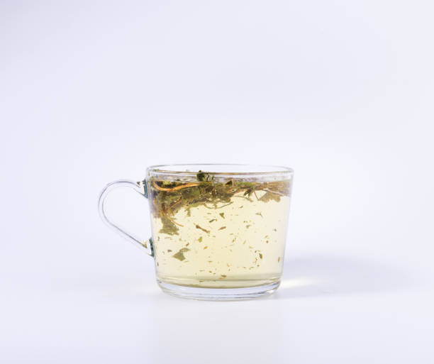 istock green herbal tea in a transparent cup isolated on white background 1137832325
