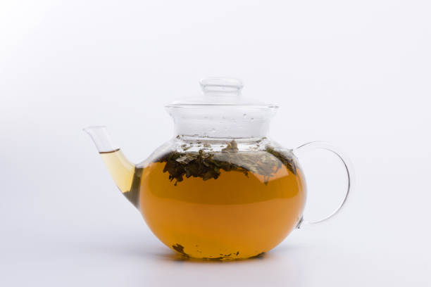 istock Glass teapot with herbal tea isolated on white background 1137832345