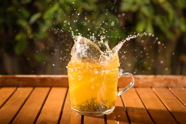 istock Splash in the transparent cup of fresh beverage outdoors, summertime 1137832422