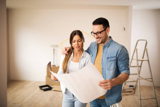 istock Couple looking at blueprint 1137836688