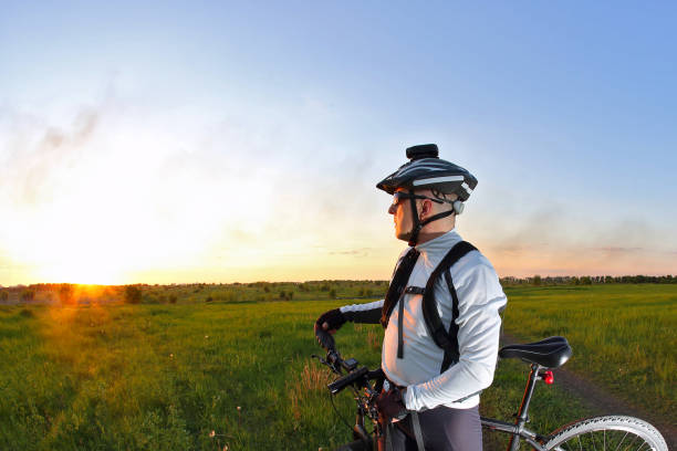 istock cyclist on Bicycle looks at sunset 1137842333