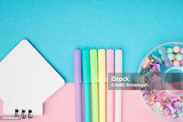 Notebook Pen Paper Clips On Pastel Paper Background Top View Place For Text Horizontal Stock Photo - Download Image Now