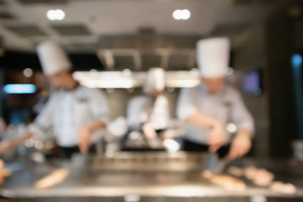 istock Chef cooking in restaurant kitchen blurred defocused background 1137845445