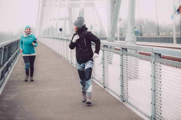 istock Female friends exercising together 1137845777