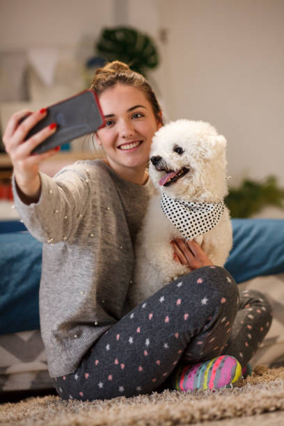 istock Girl makes a selfie together with her dog 1137846508