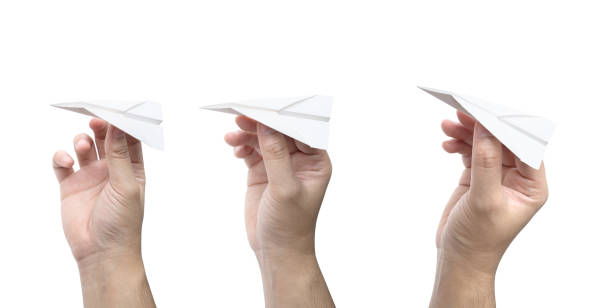 istock Hand holding a paper plane isolated on white background 1137846539
