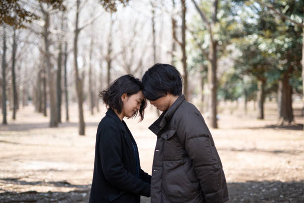 Young couple dating in Yoyogo Park in Tokyo
