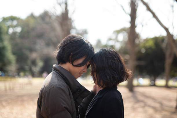 istock Young couple dating in park 1137850855