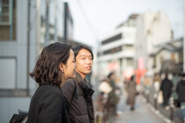 istock Couple talking and relaxing on street 1137851608