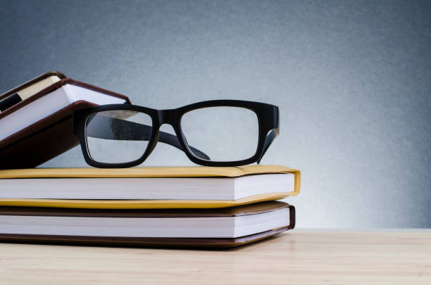 istock Education concept, spectacles on stack of books over beautiful gradient background with reverberation 1137863694