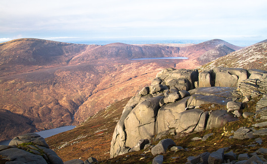Weathered rock sits on the peak of Slieve Binnian in the Mourne Mountains, Northern Ireland, UK.