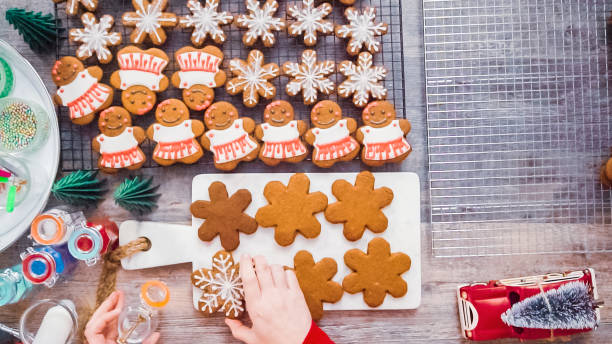 istock Decorating gingerbread cookies with royal icing. 1137868408