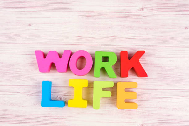 istock Work Life concept word on wooden desk over lighting effect background 1137874015