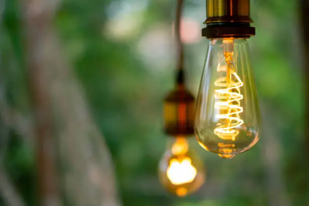 Photo of Classic retro incandescent led electric lamp on blurred background,Vintage light bulb