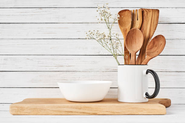 istock Cooking utensils and cutting board on white table 1137891434
