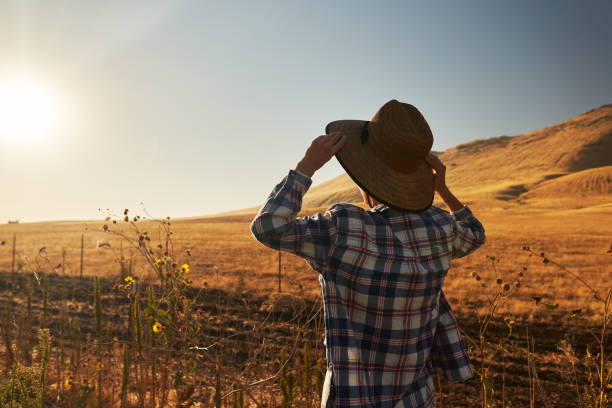 istock woman wearing hat from behind looking at view 1137895148