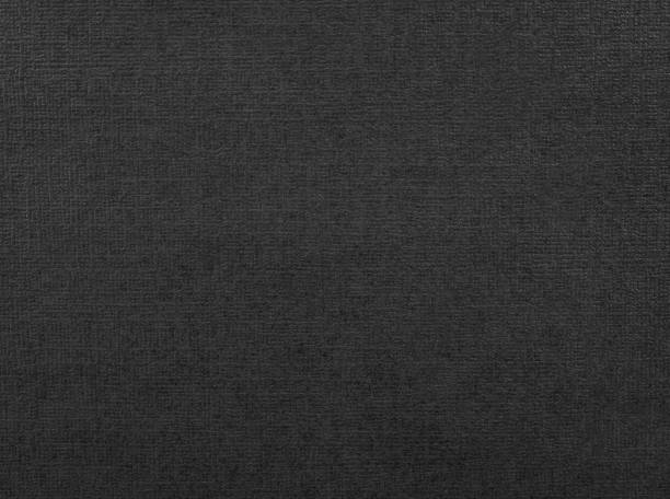istock Black paper texture. Background of dark material made from cardboard. 1137901320