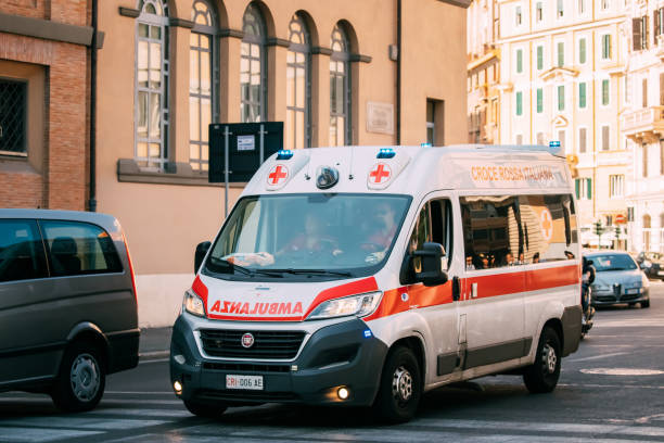 Rome, Italy. Moving With Siren Emergency Ambulance Reanimation Van Fiat Car On Street. Emergency Lights System Els Activated stock photo