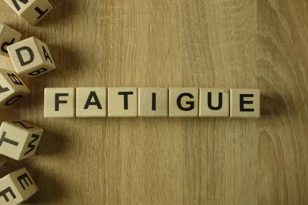 Photo of Fatigue word from wooden blocks